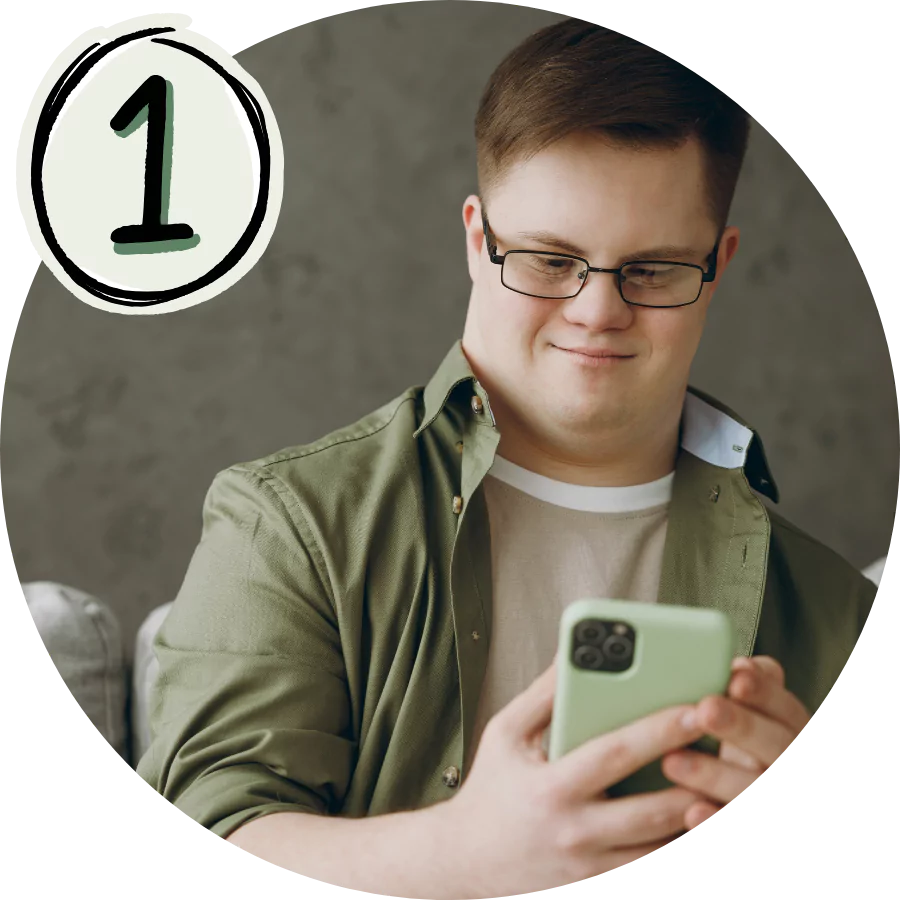 Disabled man with down syndrome making a phone call to support worker