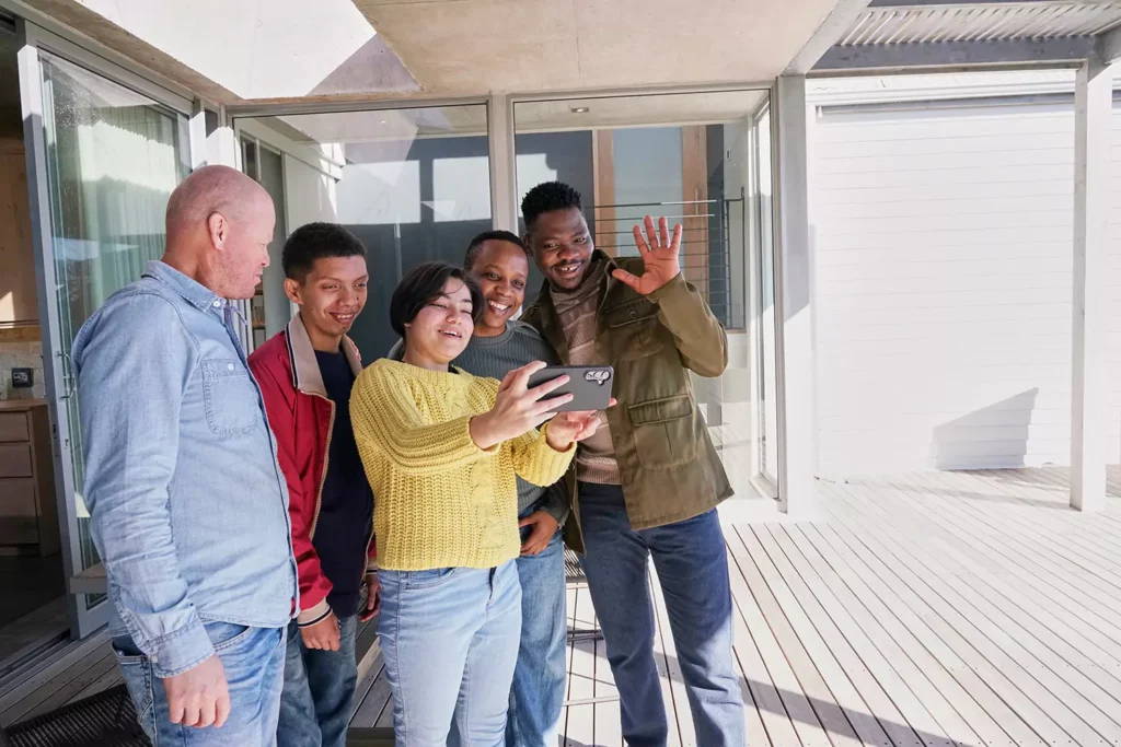 Group of diverse friends taking a selfie together